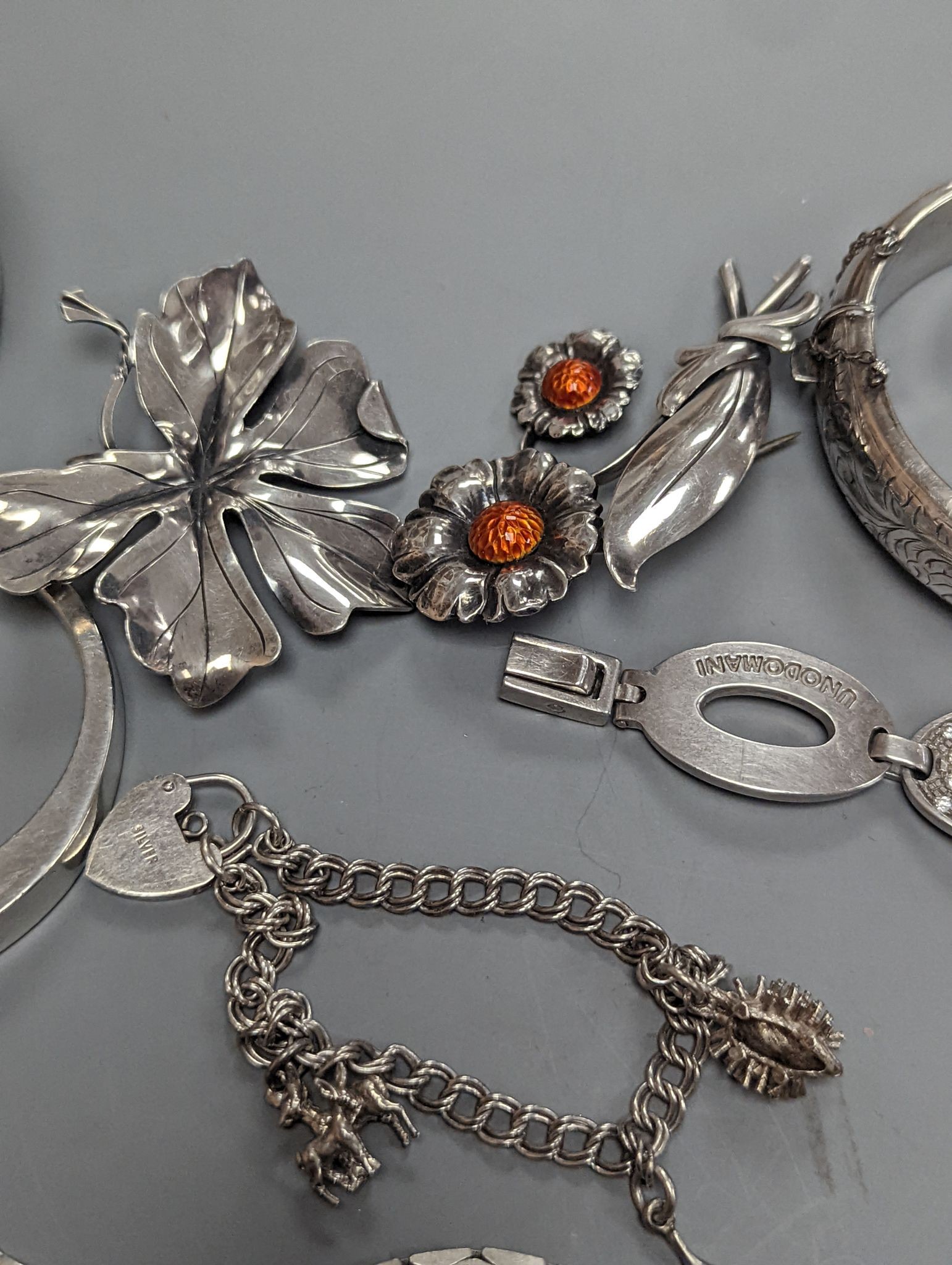 A quantity of assorted jewellery etc. including Danish sterling bangle and leaf brooch, a white meta and niello bracelet and a 925 and enamel flower brooch.